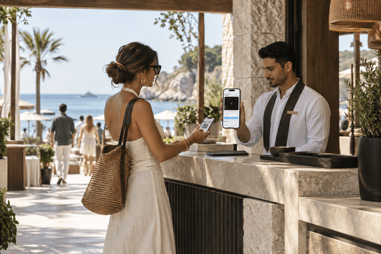 A beach club host checking a guest's digital access pass